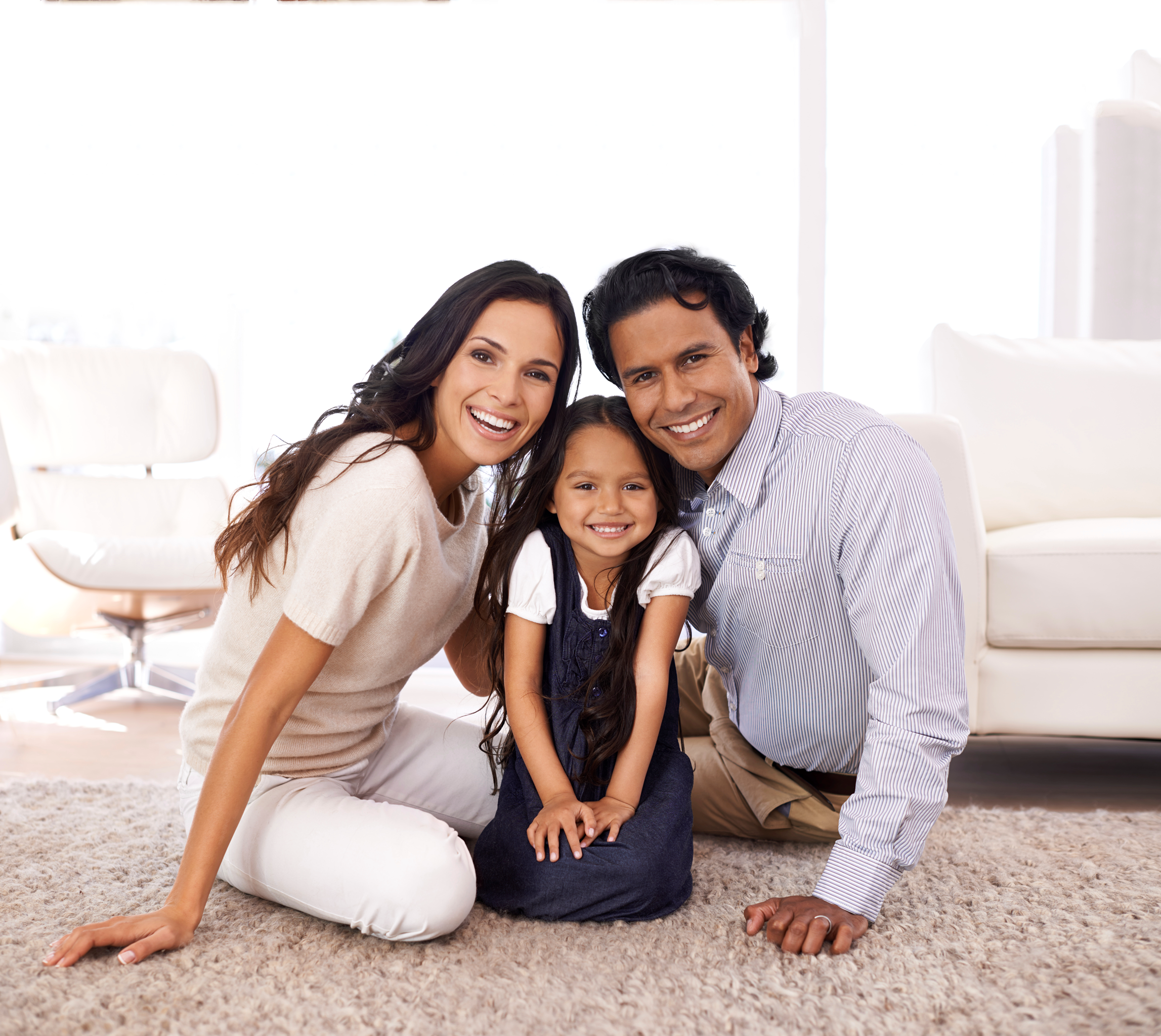 family of three sitting extended